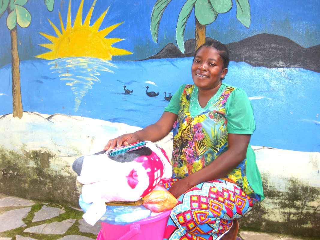 Pregnant woman being presented with Birthing hamper