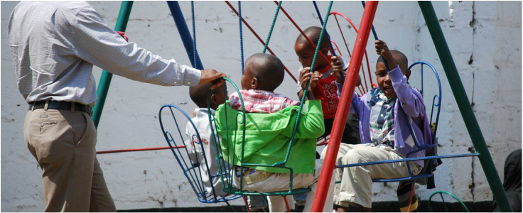 Children on the swings at TTF Clinic