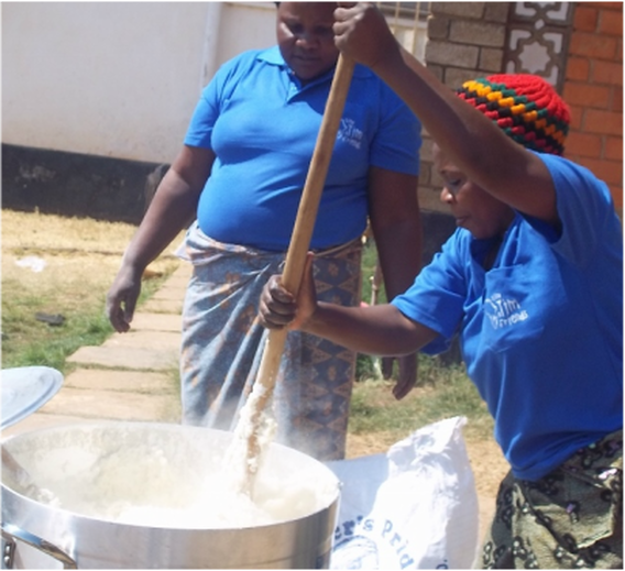 Women cooking Nshima, a staple food